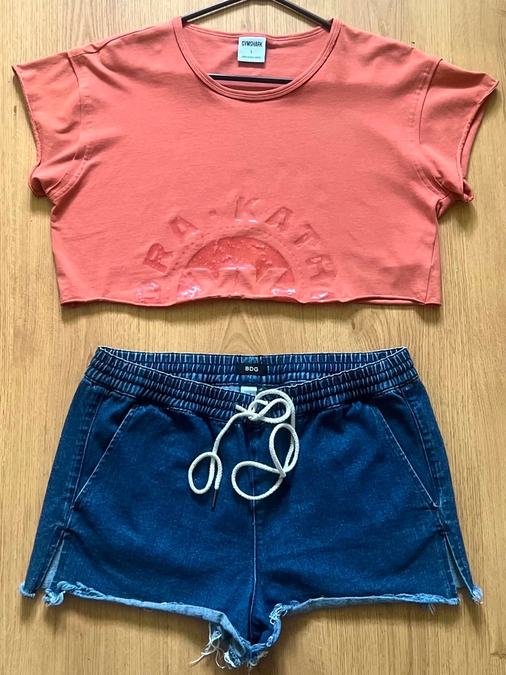 Gymshark Coral-Orange Cropped Tee and BDG Shorts